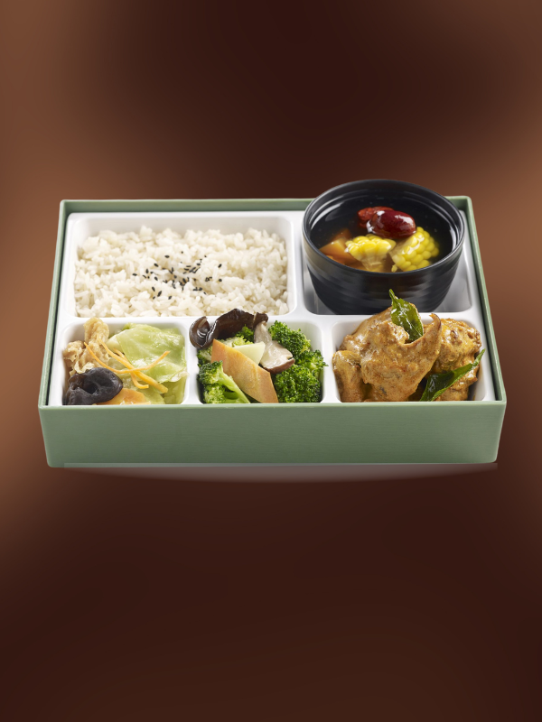 vegetarian bento box on a dark brown background