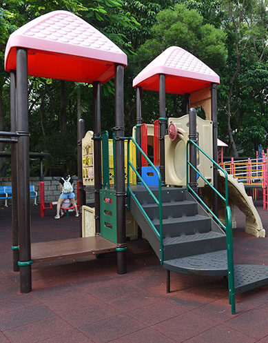 Red-roofed play towers at Kowloon Park playground in Tsim Sha Tsui