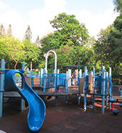 Blue slide and climbing frame at Victoria Park playground in Causeway Bay