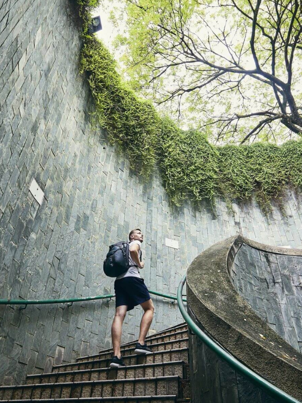 man navigating the circular staircase in Fort Canning Singapore Little Steps