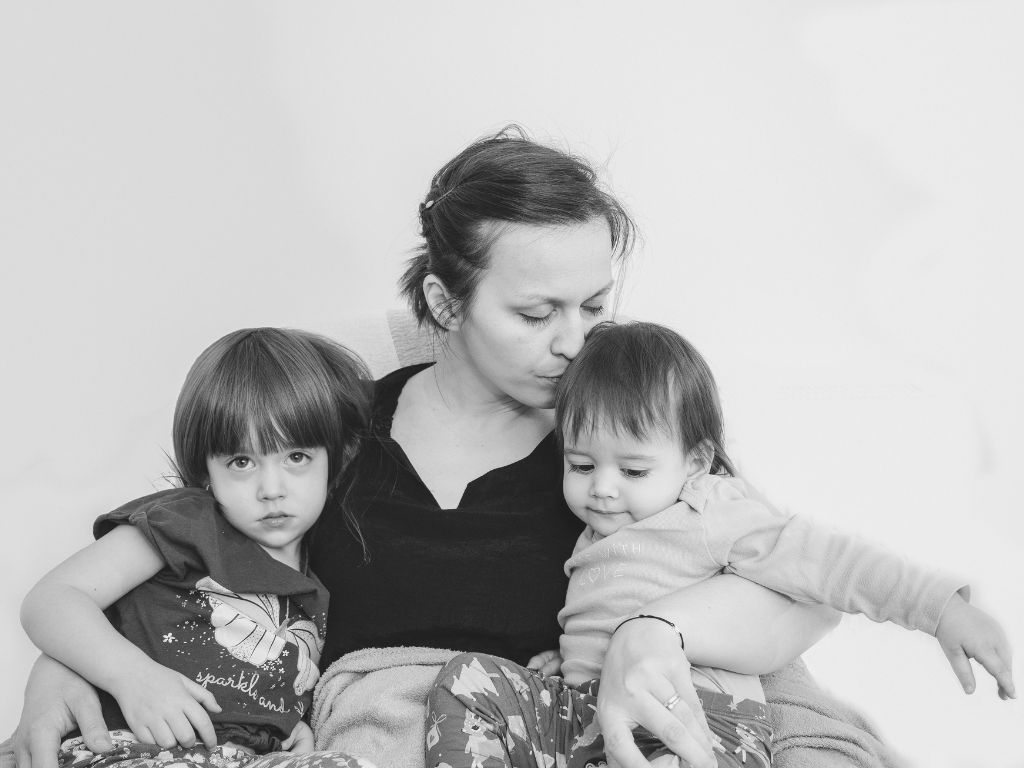 Image of a mum holding her kids - divorce singapore