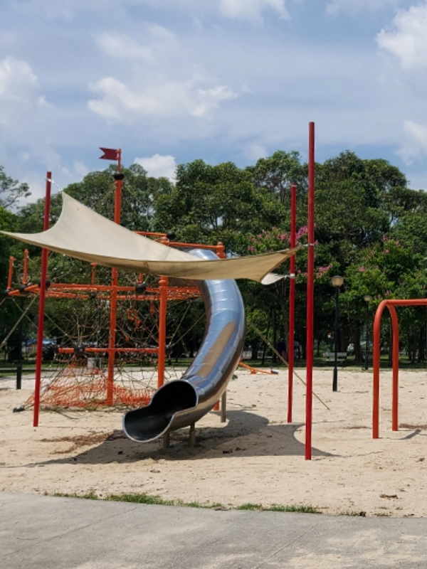 Image of tube slide and climbing nets at Changi Beach Park playground - outdoor playground singapore