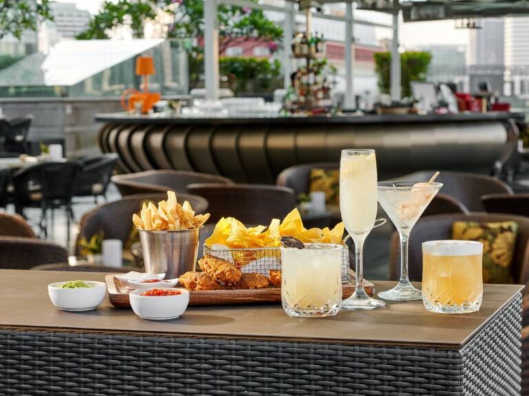 Lantern rooftop bar with infinity pool, cocktails and Marina Bay skyline views in Singapore