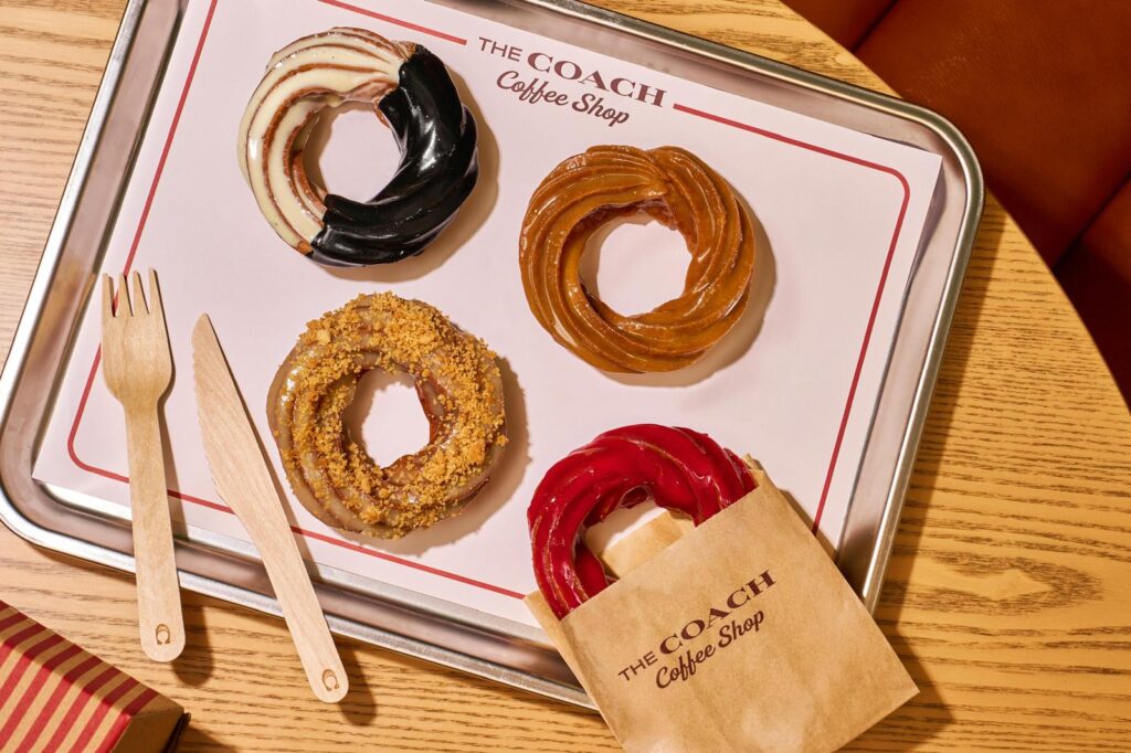 From The Bakery - Crullers (From Top Left Clockwise - Black & White, Maple Glazed, Raspberry Glazed, Apple Crumble)