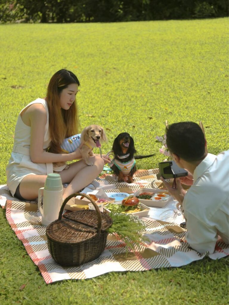 Image of couple with dogs at Park Side - cafe in park singapore
