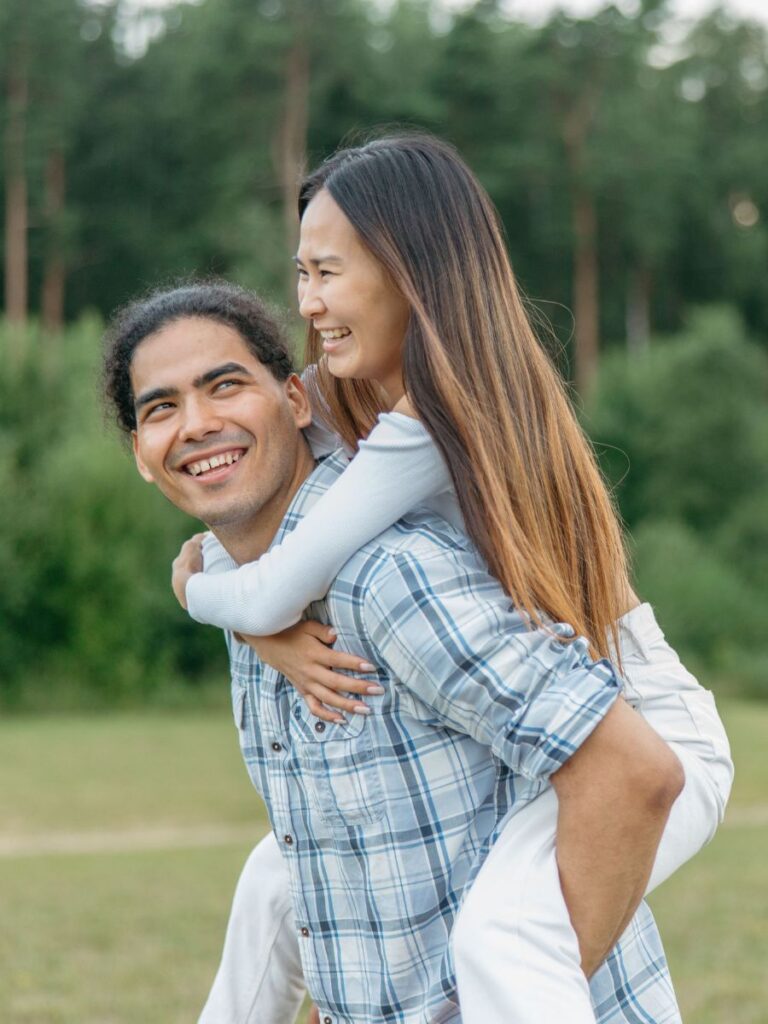 Image of man giving his wife a piggyback ride - Psych Connect - counselor singapore