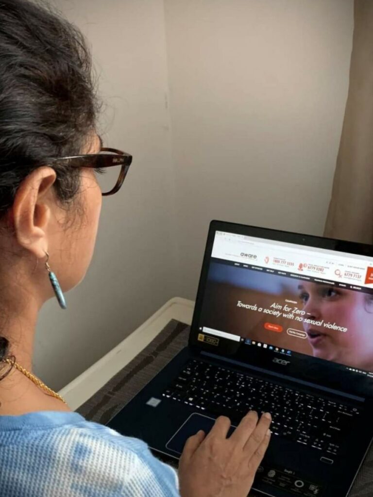 Image of woman using her laptop - AWARE - counselor singapore