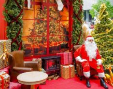 Image of Santa sitting by the Christmas tree - The Christmas Atelier 2026