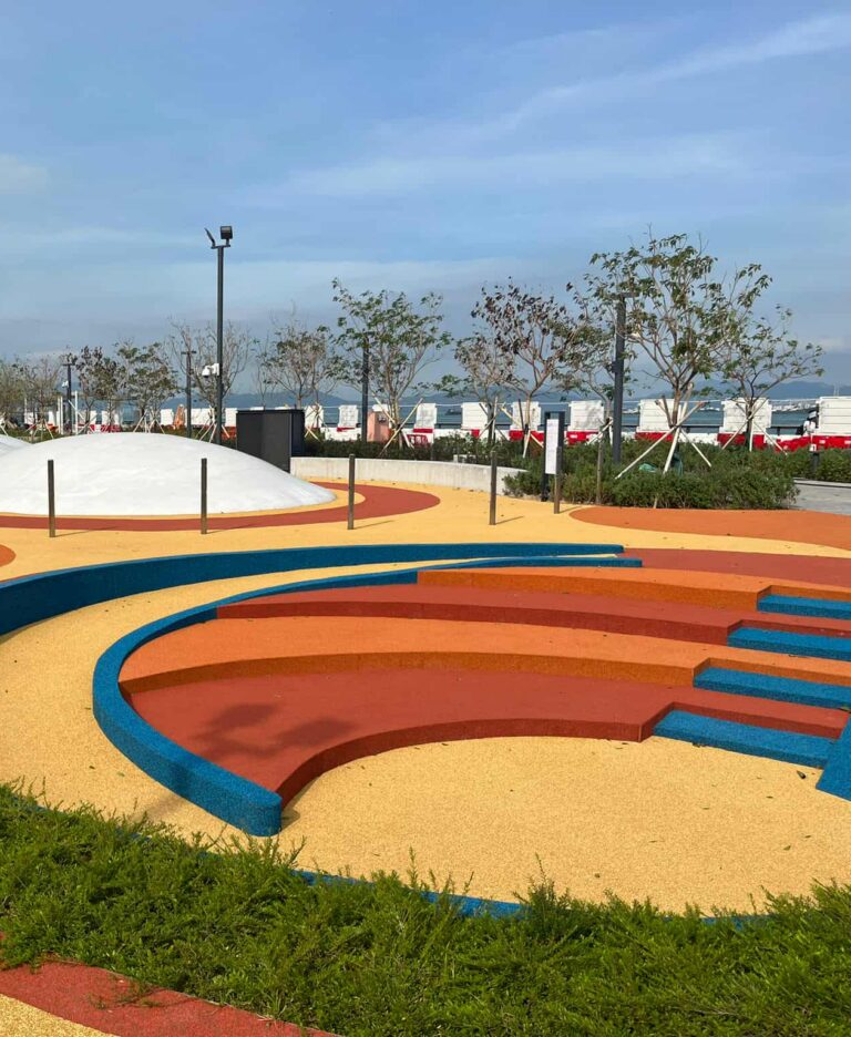Curved play mounds and lawn at Sai Ying Pun Waterfront Park
