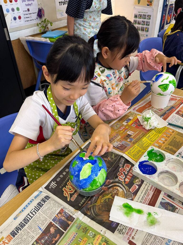 Primary students engaged in inquiry-based classroom learning at YMCA Christian Academy