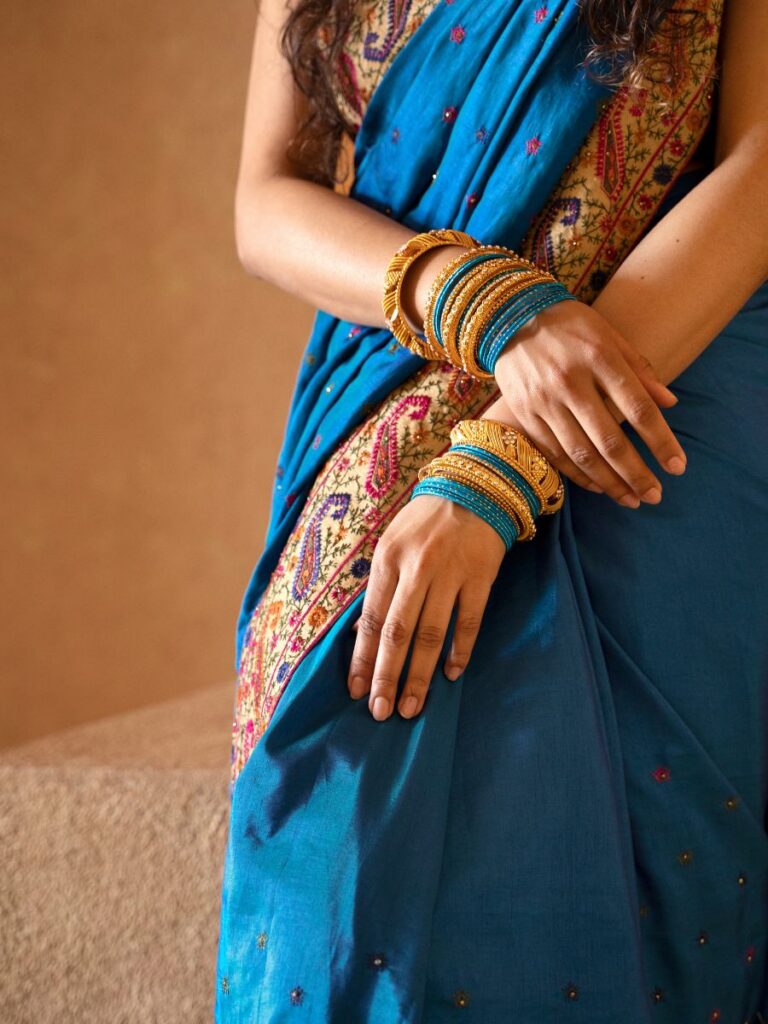 Image of woman wearing a blue saree - indian costume singapore