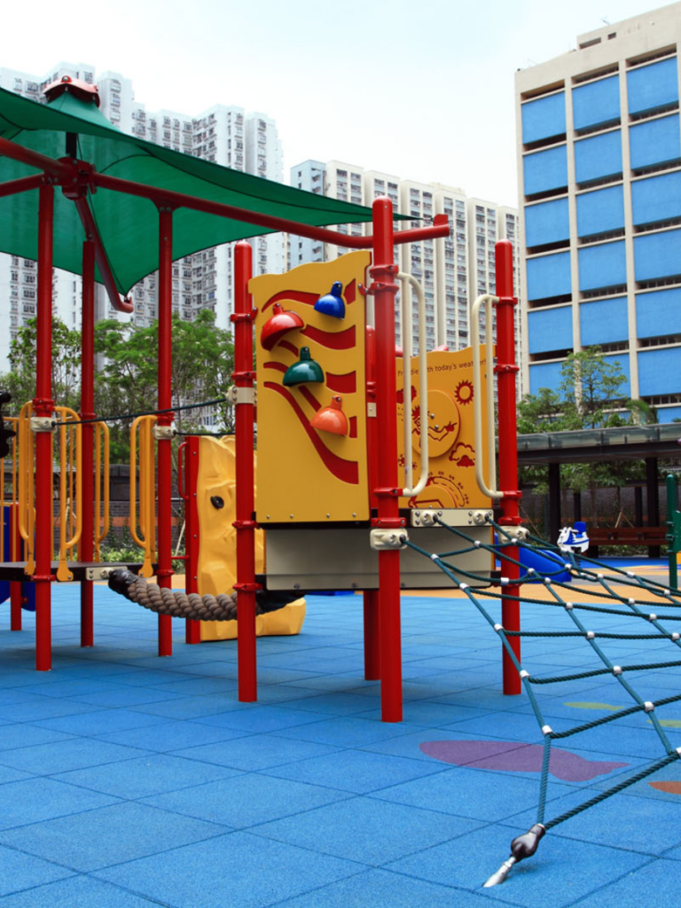 Red and yellow climbing tower at Aldrich Bay Park playground in Shau Kei Wan