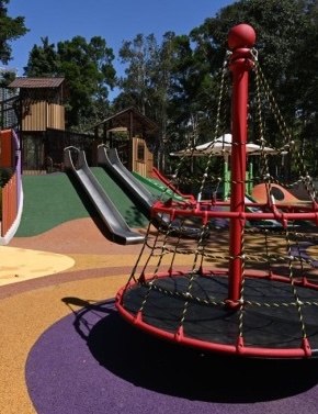 Rope net spinner and slides at the inclusive playground in Tuen Mun Park