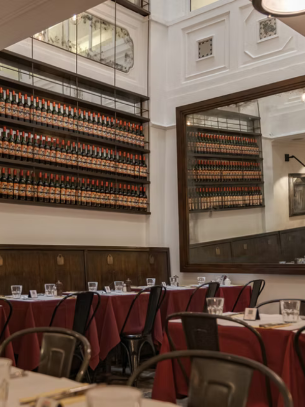 lentrecote dining room view showing wines and table setting in singapore