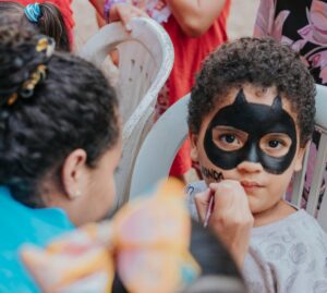 Image of boy getting face painted - Halloween makeup singapore