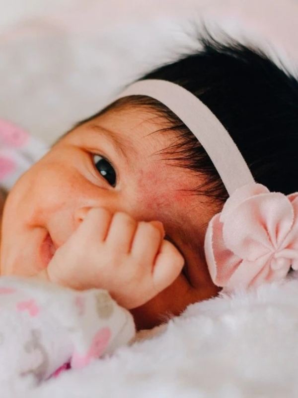 baby girl with pink headband for a parenting workshop in singapore