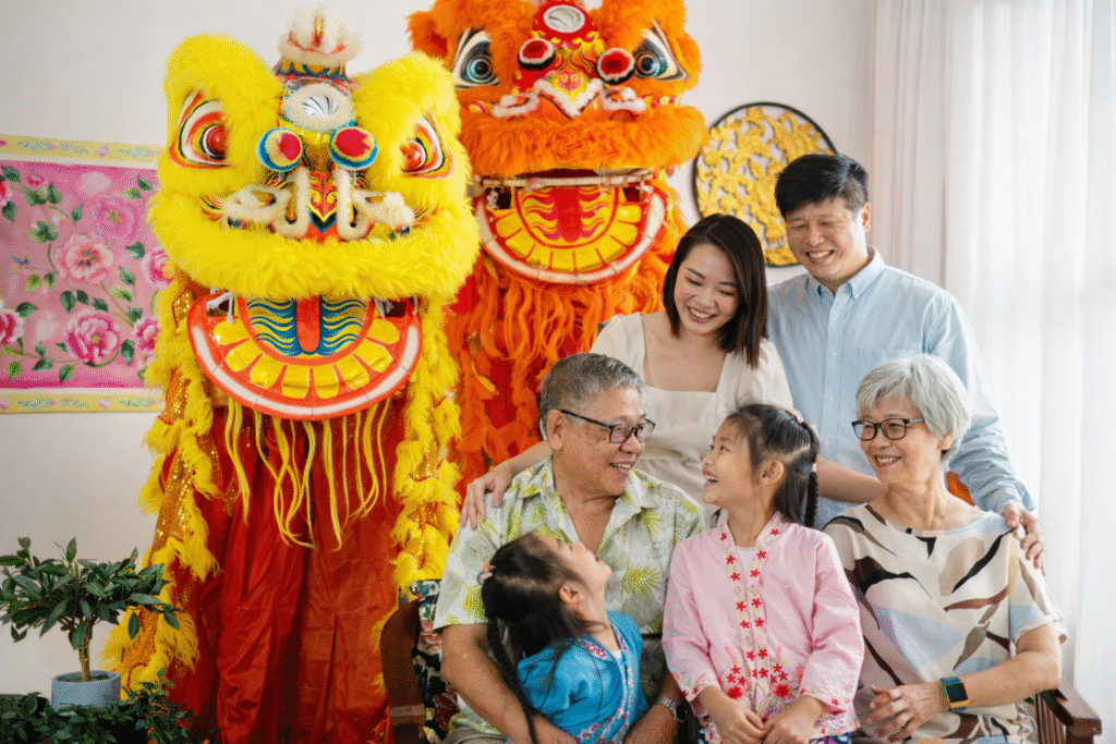 A multi-generational family posing together in festive outfits during a Chinese New Year family photoshoot in Singapore.
