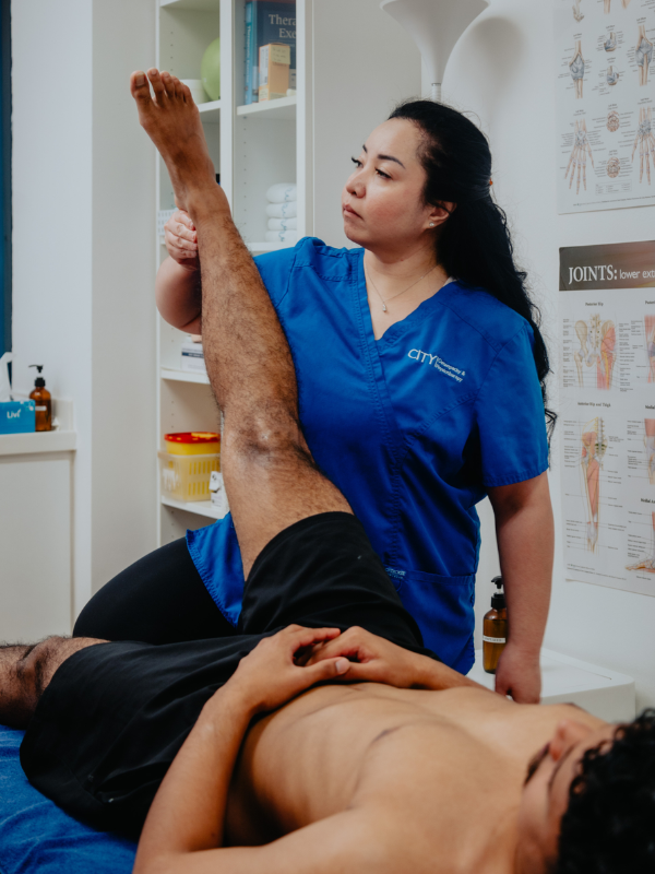 physiotherapist stretching clients leg in singapore little steps