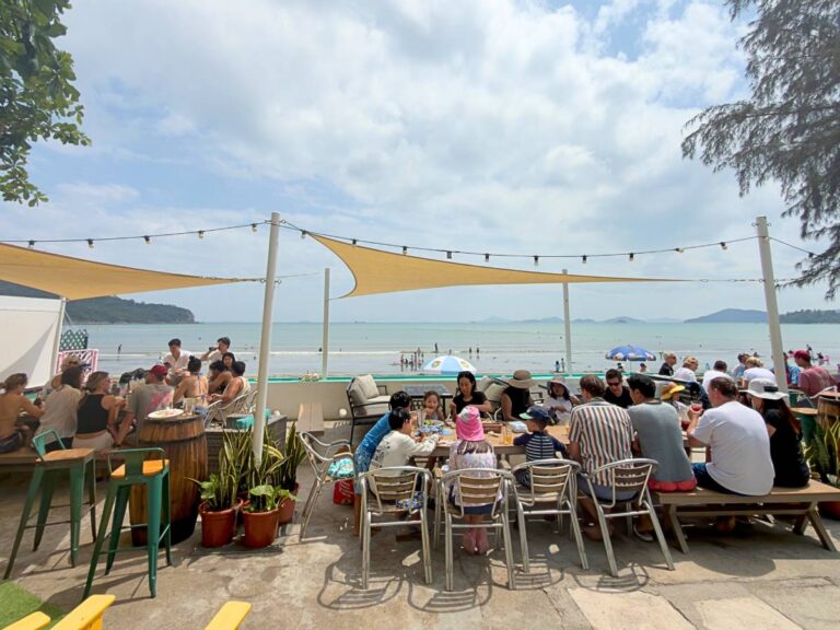 Families dining and playing on the beach at Treasure Island Beach Club on Pui O Beach, Lantau Island, Hong Kong
