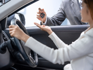 woman receiving keys to her leased car in singapore