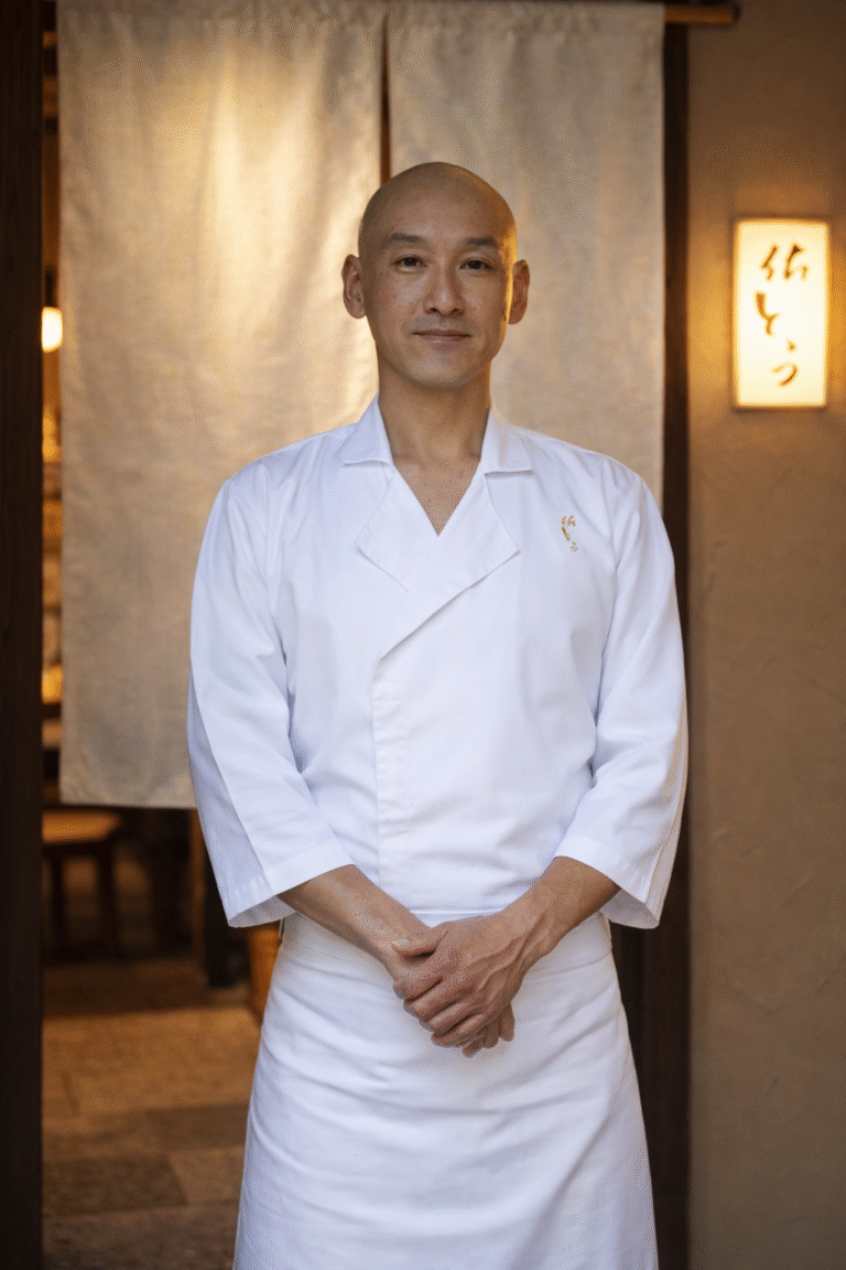 Chef standing inside Sushi Sato restaurant at Dempsey Hill, Singapore