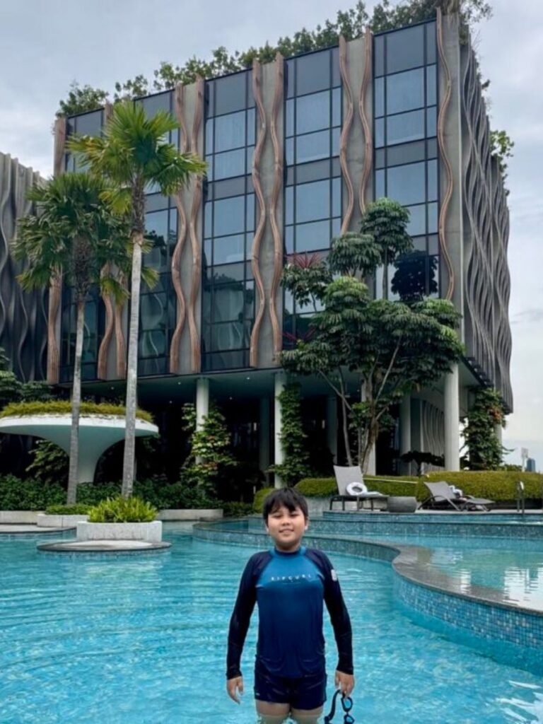 Image of boy at swimming pool in Village Hotel Sentosa