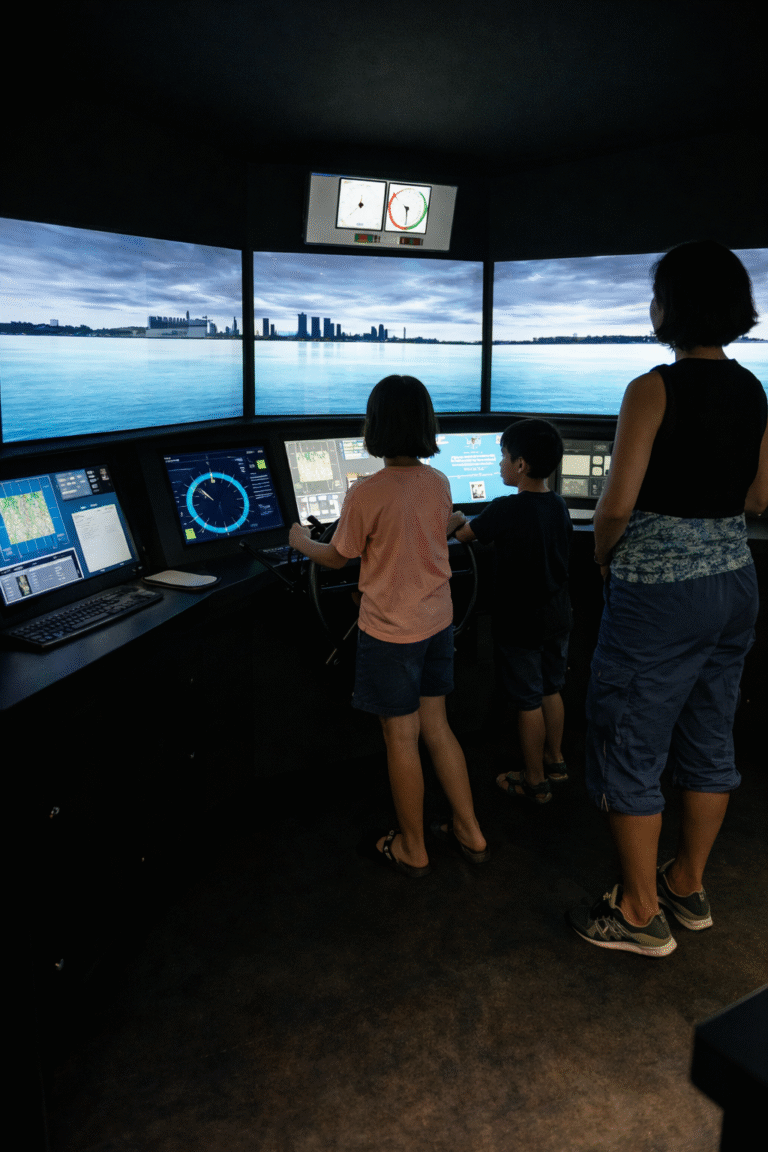 Kids using ship simulators at the Singapore Maritime Gallery in Singapore