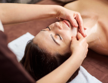 woman receiving a relaxing facial massage in a spa