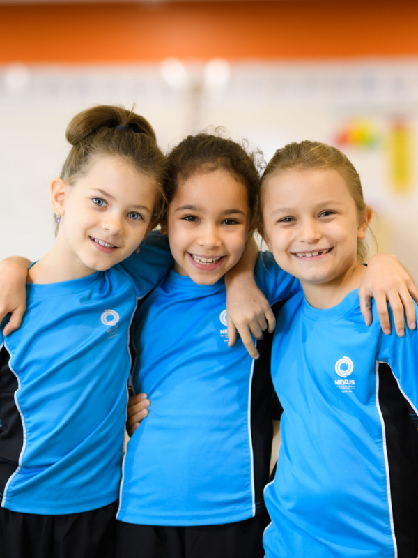 three students wearing nexus t-shirts in Singapore Little Steps