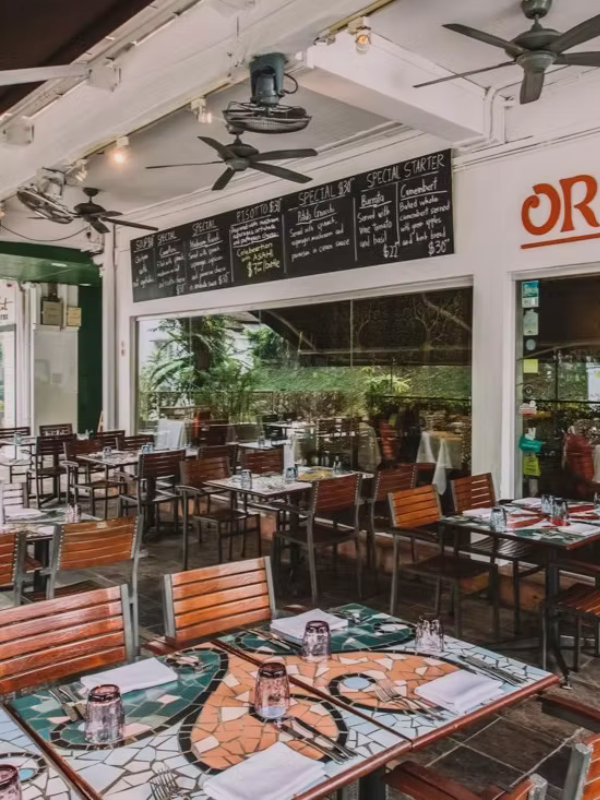 ala-carte dining area at original sin with colourful mosaic tables