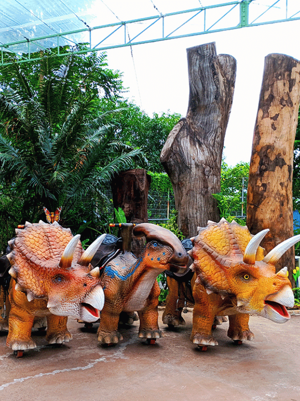 three large dinosaur creations at dinoputt mini golf in singapore little steps