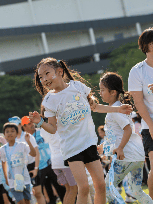 Happy young girl dancing at the Cinnamorol Run in Singapore Little Steps