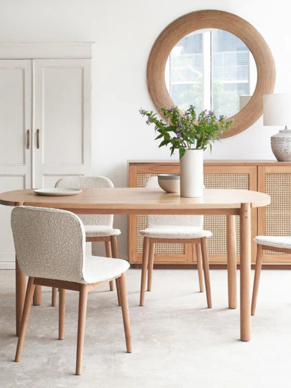 Dining room cream chair, natural wood table, round mirror from Originals in Singapore Little Steps