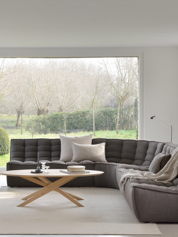 grey modular lounge and coffee table in home setting