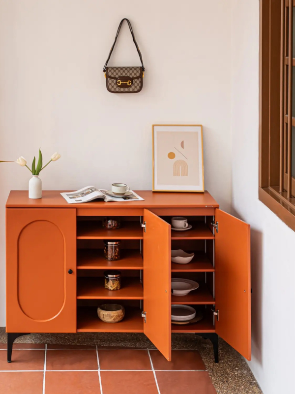 deep wooden cabinet against the wall on a tiled floor