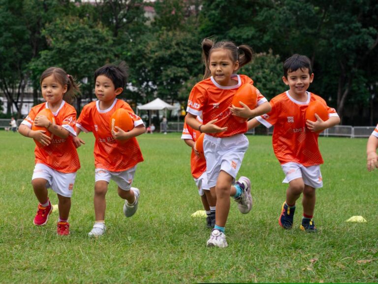 Children learning rugby through Minisport's fun multi-sport programme in Hong Kong