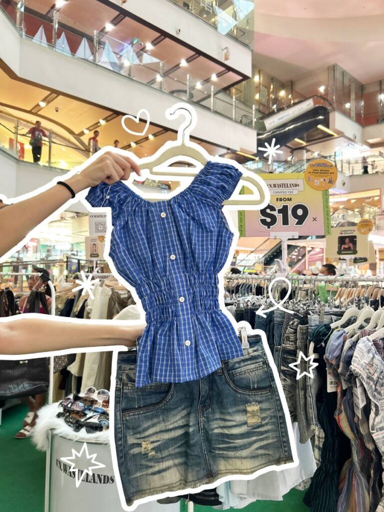 Shoppers browsing secondhand fashion at REFASH store in Singapore