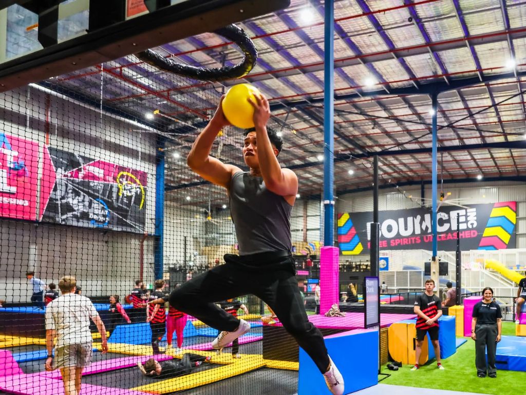 Image of boy slam dunking at BOUNCE Singapore