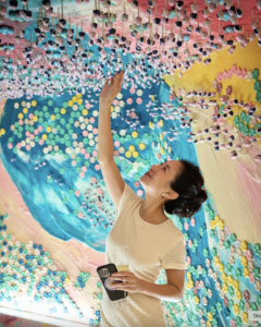 Image of woman eating at edible chocolate garden in Singapore Paragon Mall