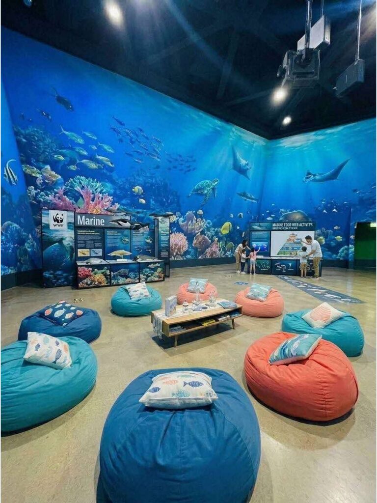 Children exploring underwater themed science activities at JUNEureka Singapore