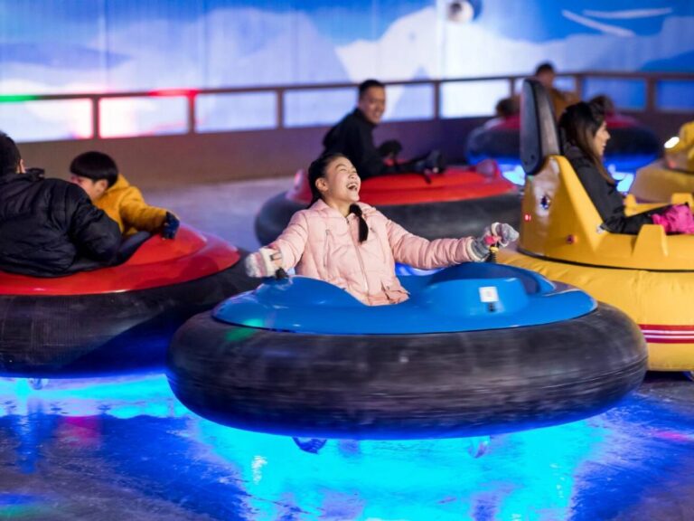Families enjoying snow activities at Snow City Singapore