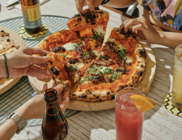 Family enjoying wood-fired pizza and activities during People People Family Day at Resorts World Sentosa Singapore