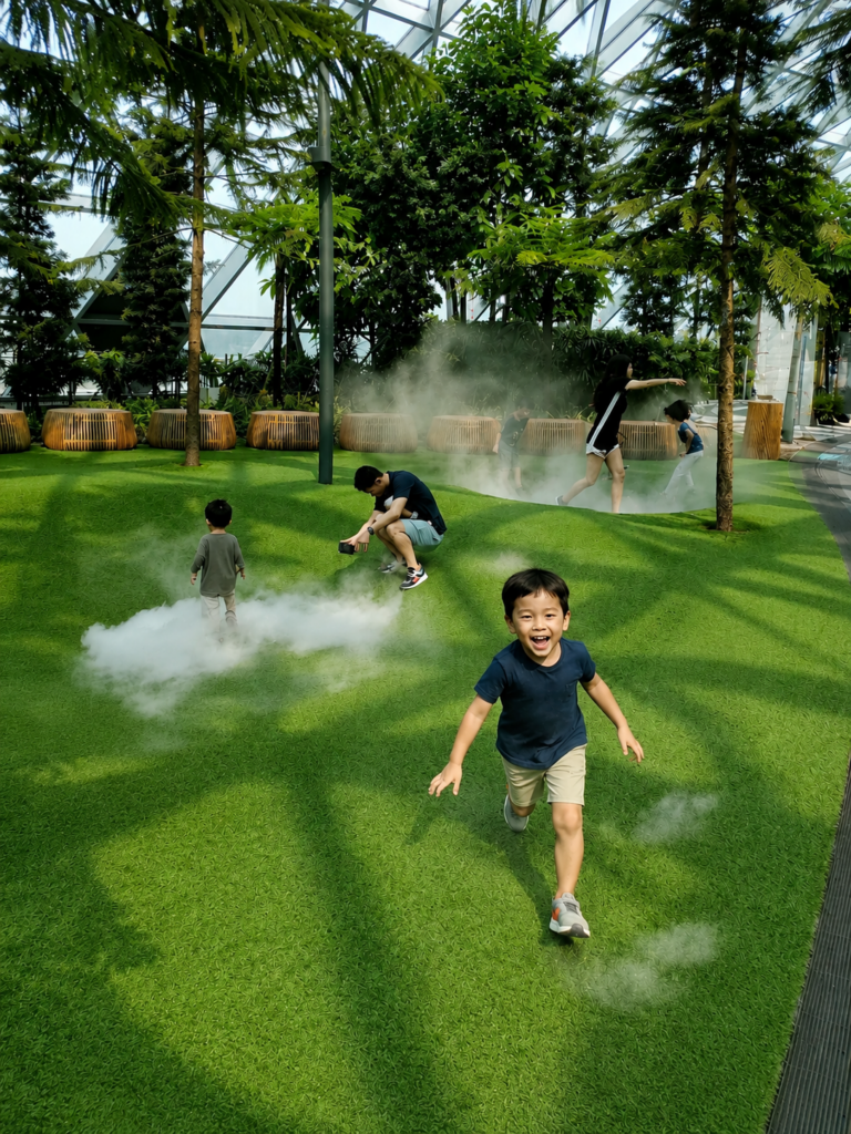Kids playing inside the Foggy Bowls mist attraction at Canopy Park in Jewel Changi Airport Singapore
