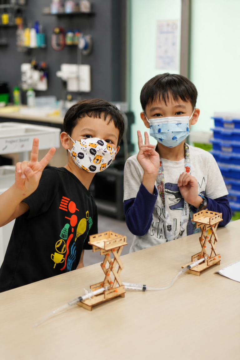 Kids building robots at Nullspace AI and Robotics summer camp in Singapore