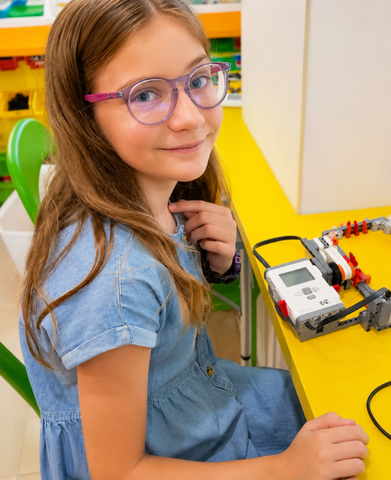 Girl learning AI and robotics at Children’s Worklab AI summer camp in Singapore