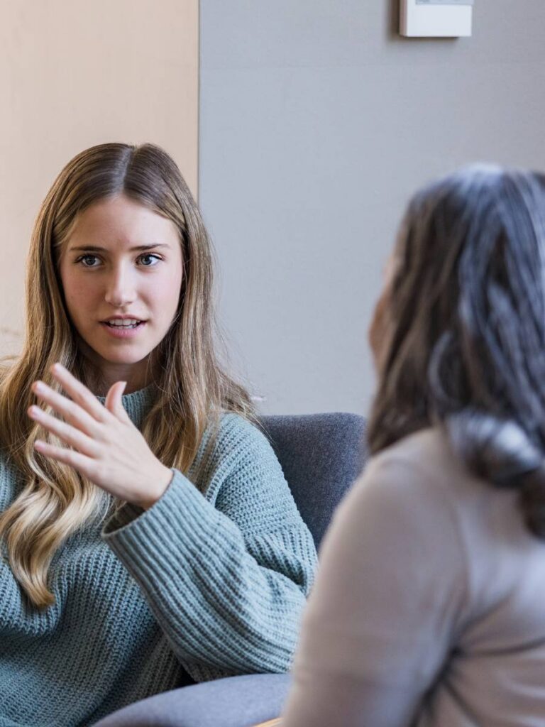 Therapist speaking with a teen during a counselling session at IMI in Central Hong Kong