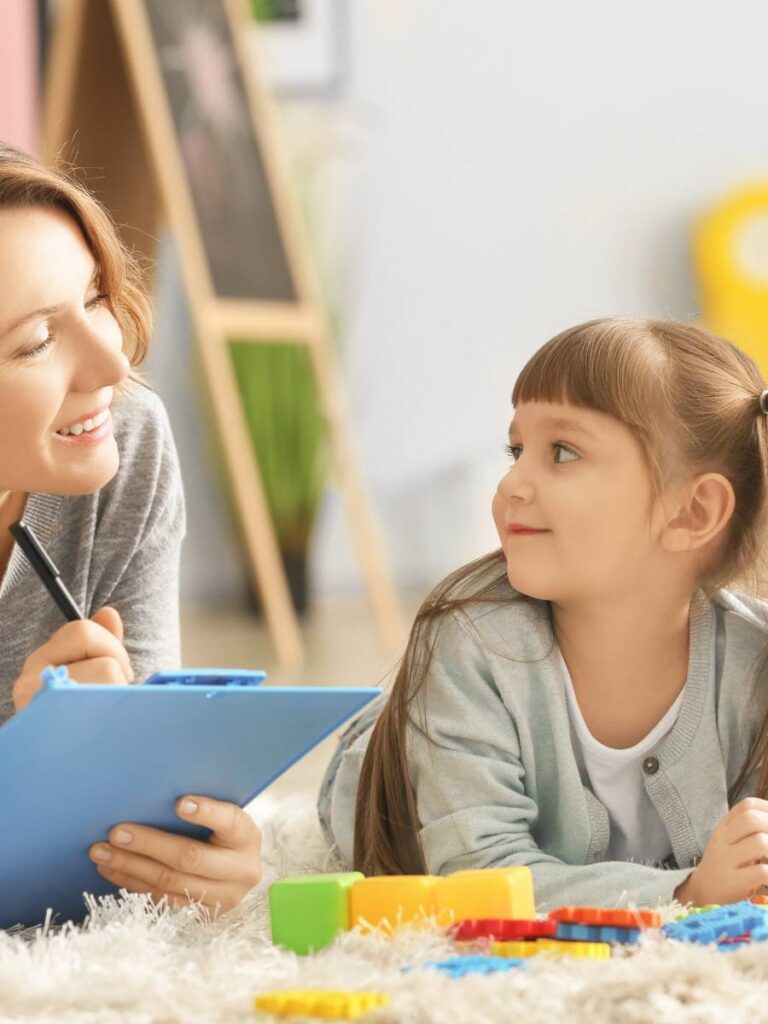 Therapist supporting a child counselling session at IMI in Hong Kong