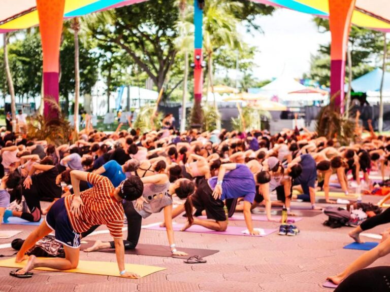 People enjoying fitness classes at Glow Festival by Prudential 2026 at Palawan Green, Sentosa, Singapore
