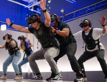 Friends playing interactive virtual reality game at Sandbox VR Singapore