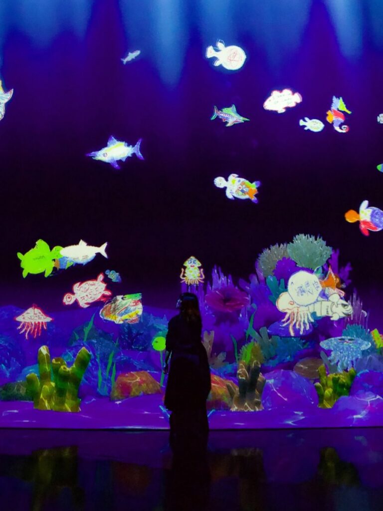 Image of woman with interactive screen at ArtScience Museum Singapore - kid-friendly museum singapore